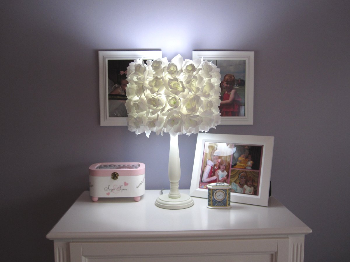 ruffle-small-white-lamp-shades-over-square-white-wooden-table-with-picture-frames